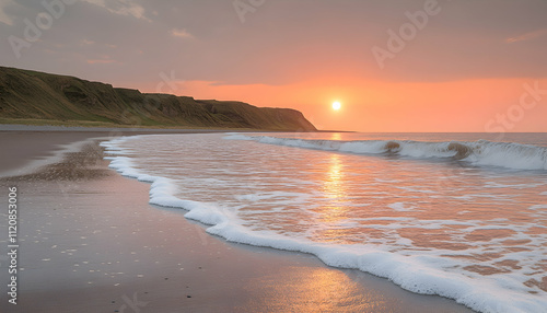 Wallpaper Mural Sunset over calm ocean waves gently lapping a sandy beach at low tide. Torontodigital.ca