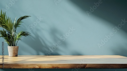 Home interior featuring wooden table and potted plant ideal for product advertising with soft shadow and soothing background colors. photo