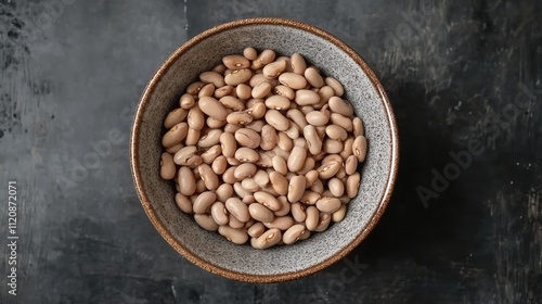 Overhead view of pinto beans in a rustic bowl perfect for healthy meal preparation and culinary presentations.