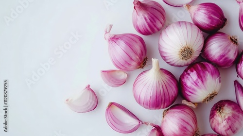 Fresh raw red onions scattered on a clean white background showcasing their vibrant colors and textures for culinary and health concepts