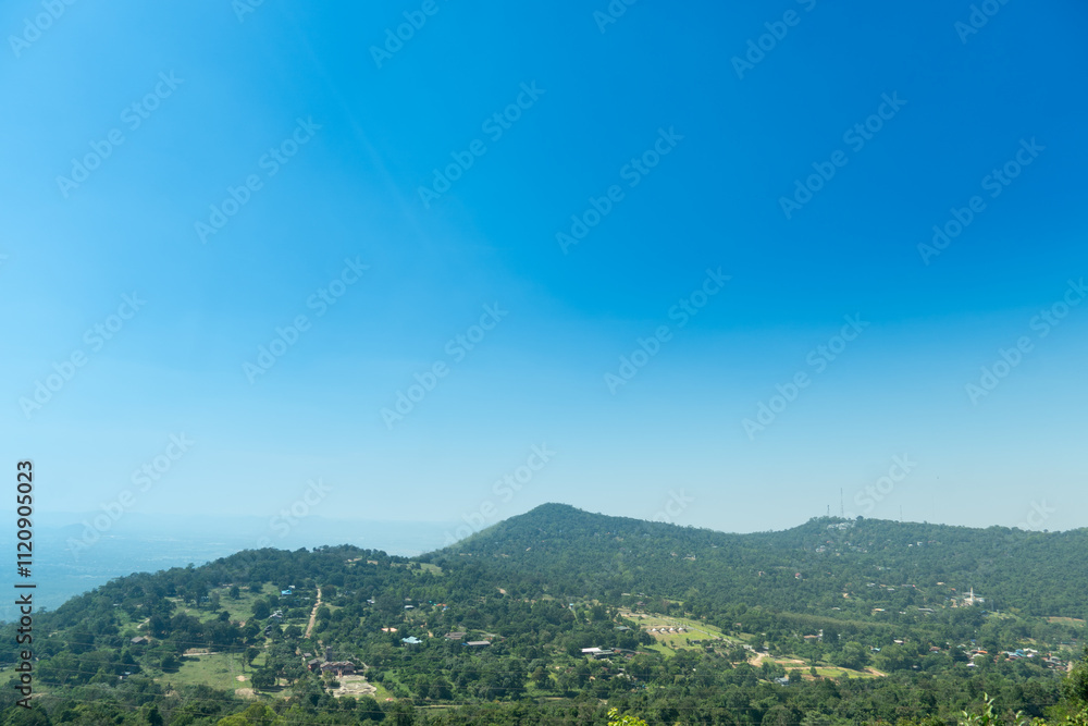 Obraz premium Small houses separated from each other on a mountain range., surrounded by trees. View of landmark of Khao Yai Thieng Windmill Nakhon Ratchasima Thailand.