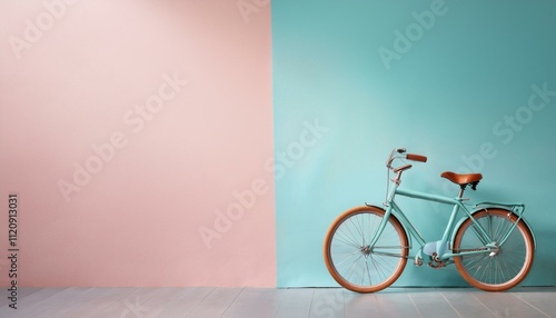 A classic bicycle leaning against a pastel-painted wall, with most of the space left intenti photo