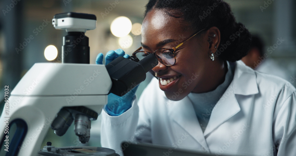 Black woman, scientist and microscope with smile for lab research and medical study with pharma investigation. Virus, staff and vaccine testing for health science with working healthcare professional Black woman, scientist and microscope with smile for lab research and medical study with pharma investigation. Virus, staff and vaccine testing for health science with working healthcare professional
