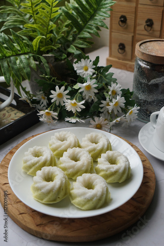 Kuih Puteri Ayu, a popular traditional Malaysian steamed sponge pandan coconut cake. photo