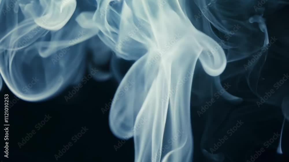 Ethereal wisps of smoke swirling gracefully against a dark background. Ethereal wisps of smoke swirling gracefully against a dark background.