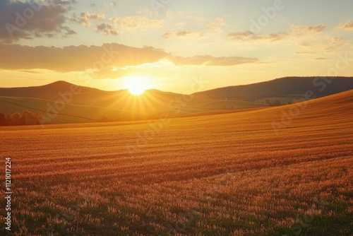 Wallpaper Mural A serene sunset over rolling hills and golden fields. Torontodigital.ca