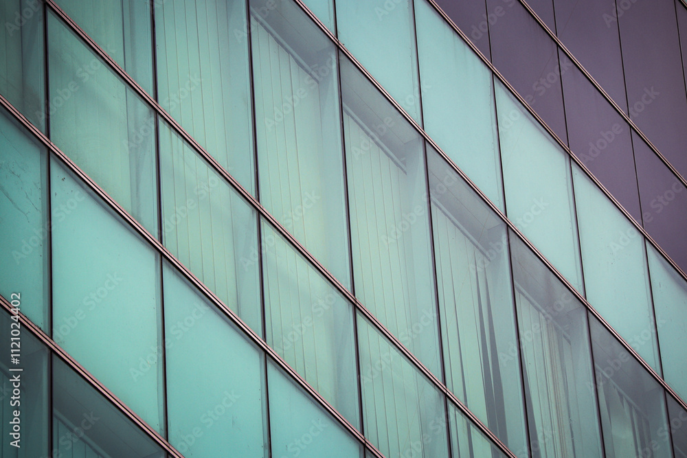 Geometric pattern of glass creates a visually striking and futuristic aesthetic on a modern building. Suitable for sci-fi, technology, and urban themes. Geometric pattern of glass creates a visually striking and futuristic aesthetic on a modern building. Suitable for sci-fi, technology, and urban themes.