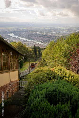 View from the Königstuhl Funicular Railroad Station with Rainy Clouds Parting for Sunrays, Overlooking the Neckar Valley and Ludwigshafen in the Distance