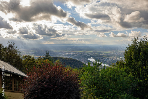 View from the Königstuhl Funicular Railroad Station with Rainy Clouds Parting for Sunrays, Overlooking the Neckar Valley and Ludwigshafen in the Distance, Scenic German Landscape