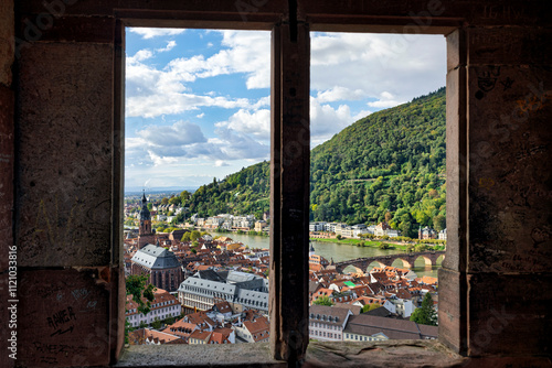 Scenic View of Heidelberg City Through Stone Window of Heidelberg Castle Under Blue Sky with Fleecy Clouds, Historic Landmark and Travel Destination in Germany
