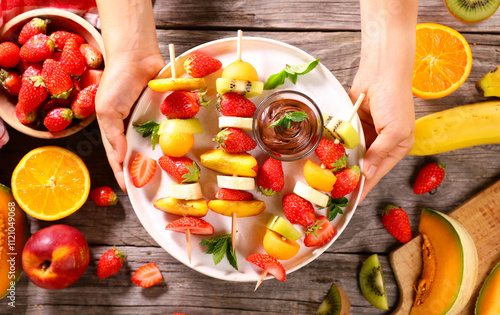 delicious and juicy fruits skewer and chocolate sauce for dipping sauce