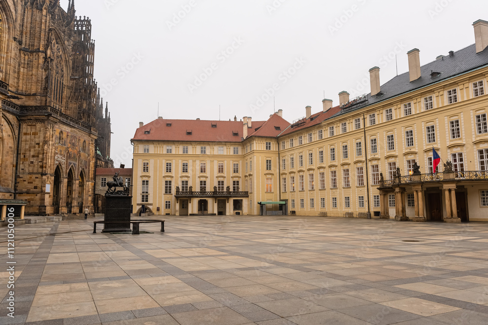 Obraz premium Huge courtyard attached to St. Vitus Cathedral in Prague with its official buildings, Czech Republic.
