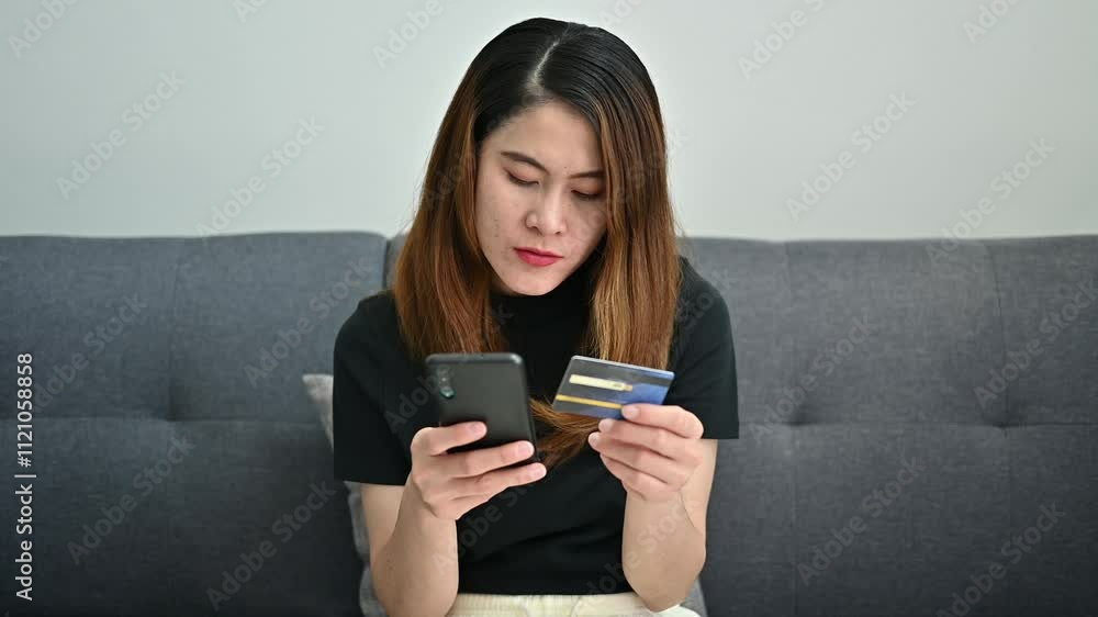 Asian woman while using credit card for shopping online on mobile phone applications. Asian woman while using credit card for shopping online on mobile phone applications.