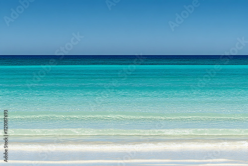 Serene coastal scene crystal-clear turquoise water gently lapping on a pristine white sandy beach under a vibrant blue sky. Perfect for travel, vacation, or relaxation themes.