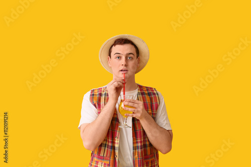 Young man in hat with cockt...