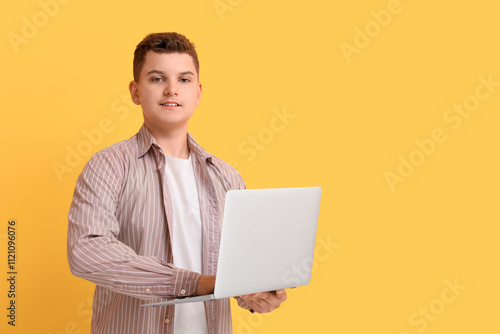 Teenage boy using modern la...