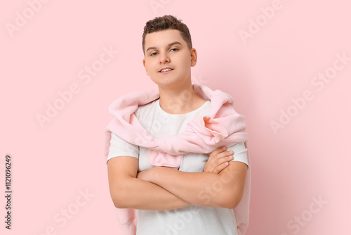 Teenage boy with crossed ar...