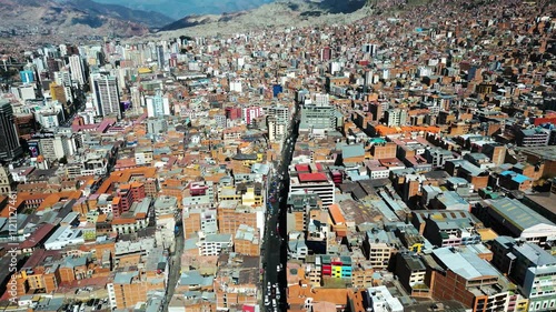 Aerial drone shot of downtown La Paz, Bolivia, showcasing a cluster of buildings and a busy street, capturing the vibrant urban atmosphere and bustling traffic photo