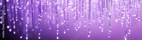 Elegant water droplets falling indoor setting close-up photography purple color palette abstract concept for visual art