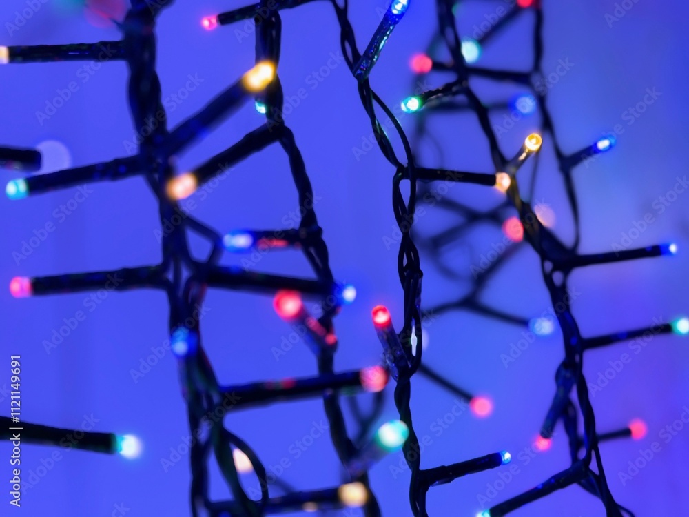 Abstract background with blurred strings of lights in assorted colours Abstract background with blurred strings of lights in assorted colours