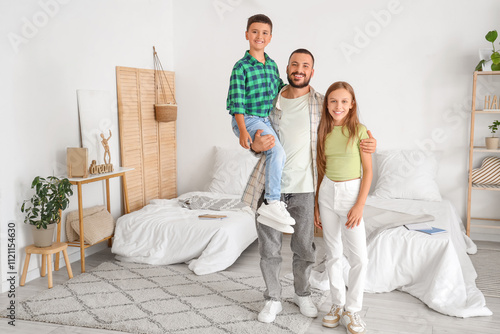 Happy father and two childr...
