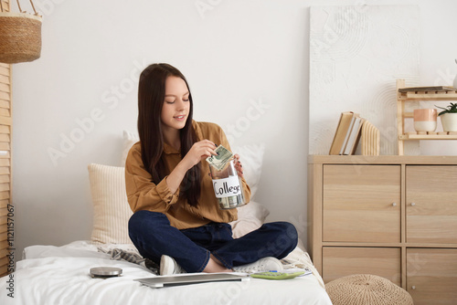 Young woman with savings fo...