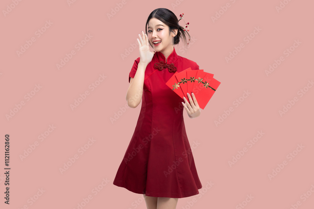 Beauty Asian woman in red Cheongsam Chinese traditional dress celebrating with lucky red envelopes on Chinese New Year festival isolated on pink background. Beauty Asian woman in red Cheongsam Chinese traditional dress celebrating with lucky red envelopes on Chinese New Year festival isolated on pink background.