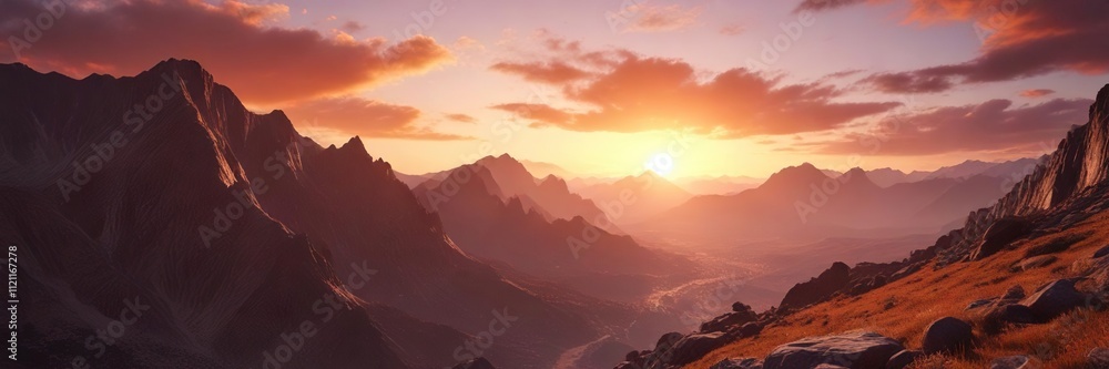 Obraz premium A stunning vista of a valley below the rugged mountain range against a fiery orange-red sunset sky, dramatic lighting, earthy tones, geological formations