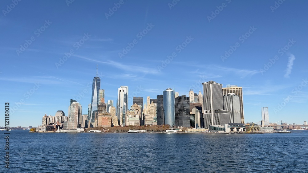 A cloudy New York City skyline featuring iconic rooftop water towers, historic architecture, and modern high-rises, capturing urban contrast. A cloudy New York City skyline featuring iconic rooftop water towers, historic architecture, and modern high-rises, capturing urban contrast.