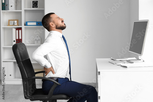 Young businessman suffering...