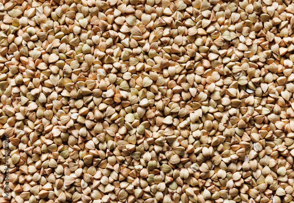 Green buckwheat groats, close up view, macro. Buckwheat background Green buckwheat groats, close up view, macro. Buckwheat background