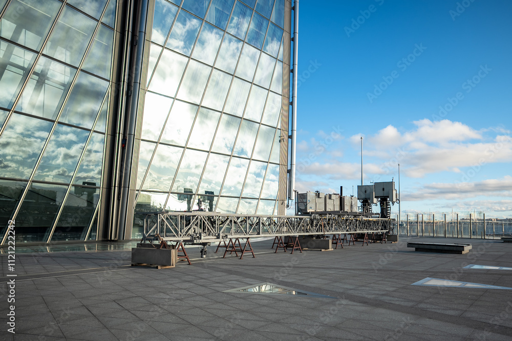 Photo inspiration: Visual Reference: Facade Cleaning Device For Skyscraper Glass Walls Reflecting Sunlight
