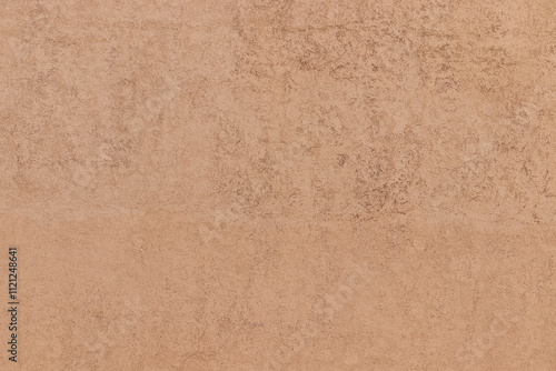 Old yellow-brown plastered house wall as background