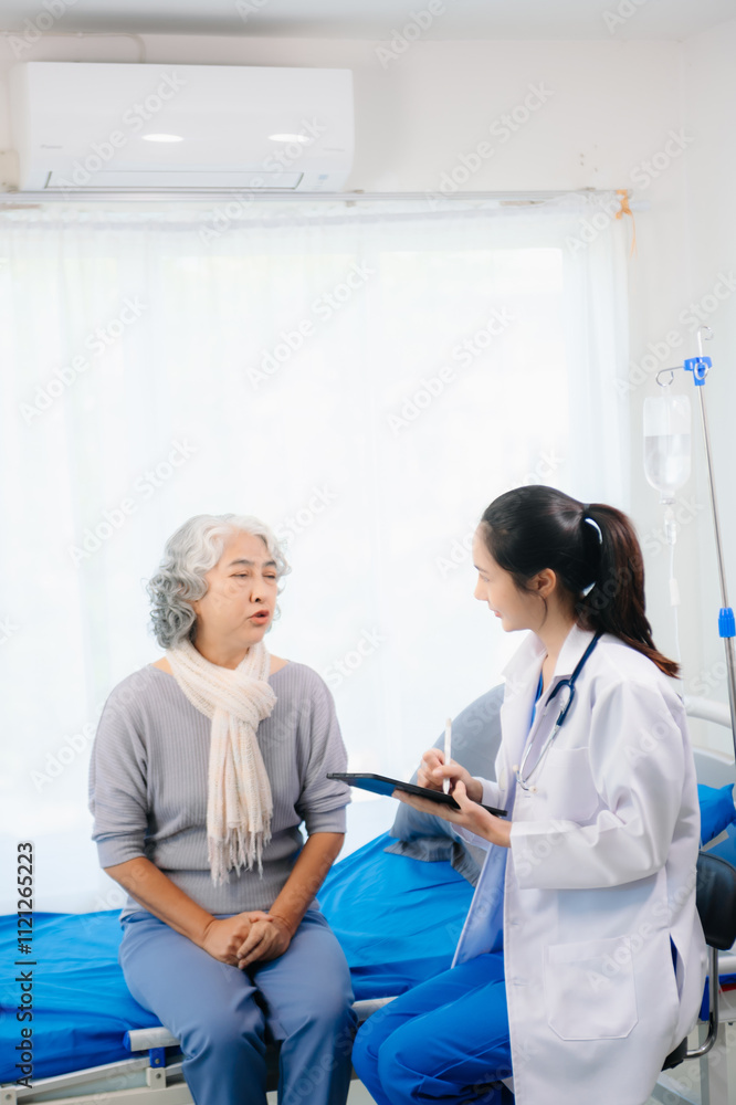 Obraz premium Smiling doctor discussing health with elderly patient. Perfect for medical, healthcare, caregiving,