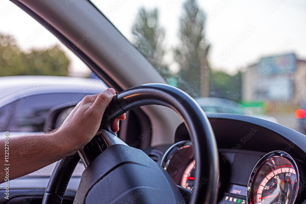male driver is driving in a passenger car during a traffic jam yesterday. driving on the left male driver is driving in a passenger car during a traffic jam yesterday. driving on the left