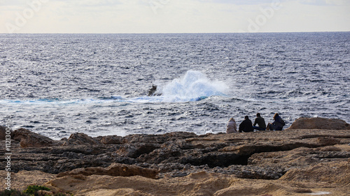 Waves breaking on a rock
