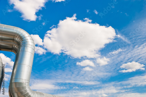 pipeline line close-up against blue sky and clouds photo