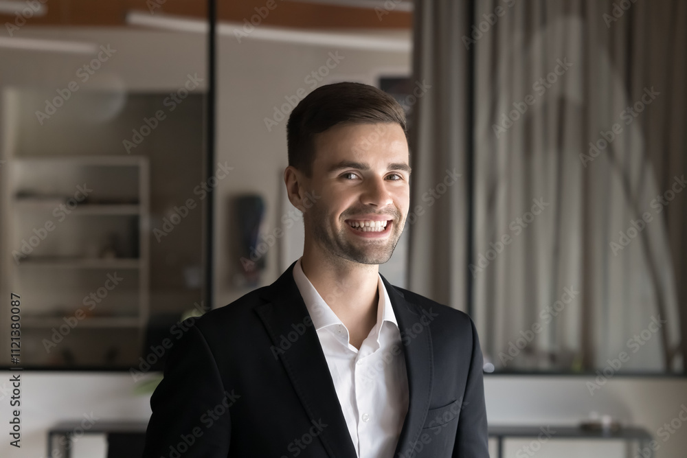 Head shot portrait young happy businessman, office employee, male HR manager or CEO dressed in formal jacket posing in modern workspace, feel satisfied with achievements, career growth and promotion Head shot portrait young happy businessman, office employee, male HR manager or CEO dressed in formal jacket posing in modern workspace, feel satisfied with achievements, career growth and promotion