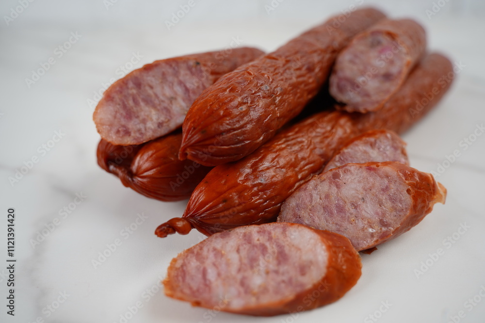 A pile of smoked sliced kabanos sausages A pile of smoked sliced kabanos sausages