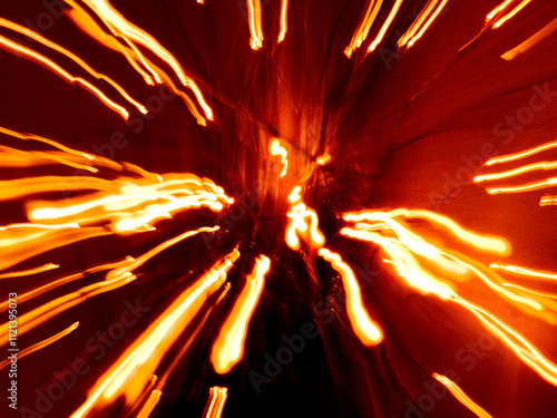 Abstract orangey red light streaks against a dark background