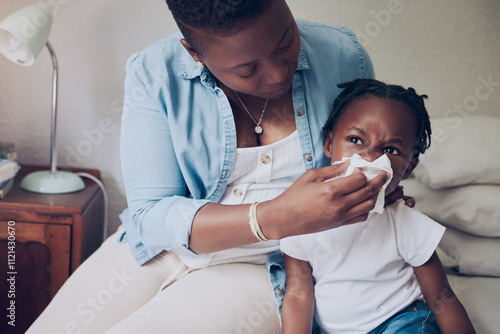 Konstfotografi Black family, mom and blowing nose of child in home, support sick kid and help with nasal infection