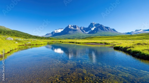 Serene landscape with mountains and a clear river under blue sky.