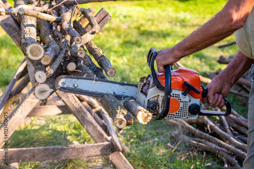Man cutting wood with chainsaw