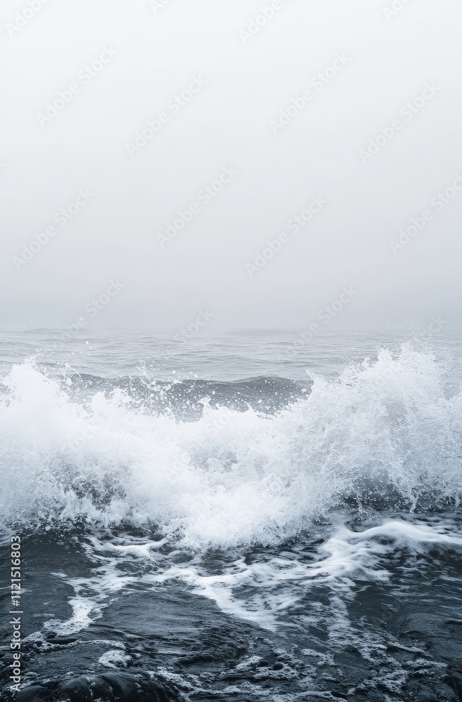 Powerful ocean waves crashing against a misty horizon Powerful ocean waves crashing against a misty horizon