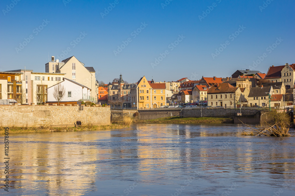 River Saale flowing through the old center of Bernburg, Germany