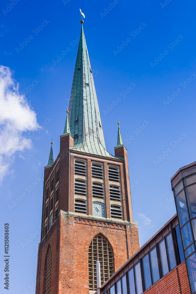 Tower of the historic Schweizer Kirche church in Emden, Germany