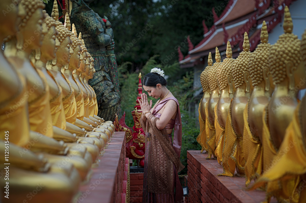Fototapeta premium women in traditional clothing on Buddhist on background. Portrait women in traditional clothing , Thai traditional in Ayutthaya, Thailand.