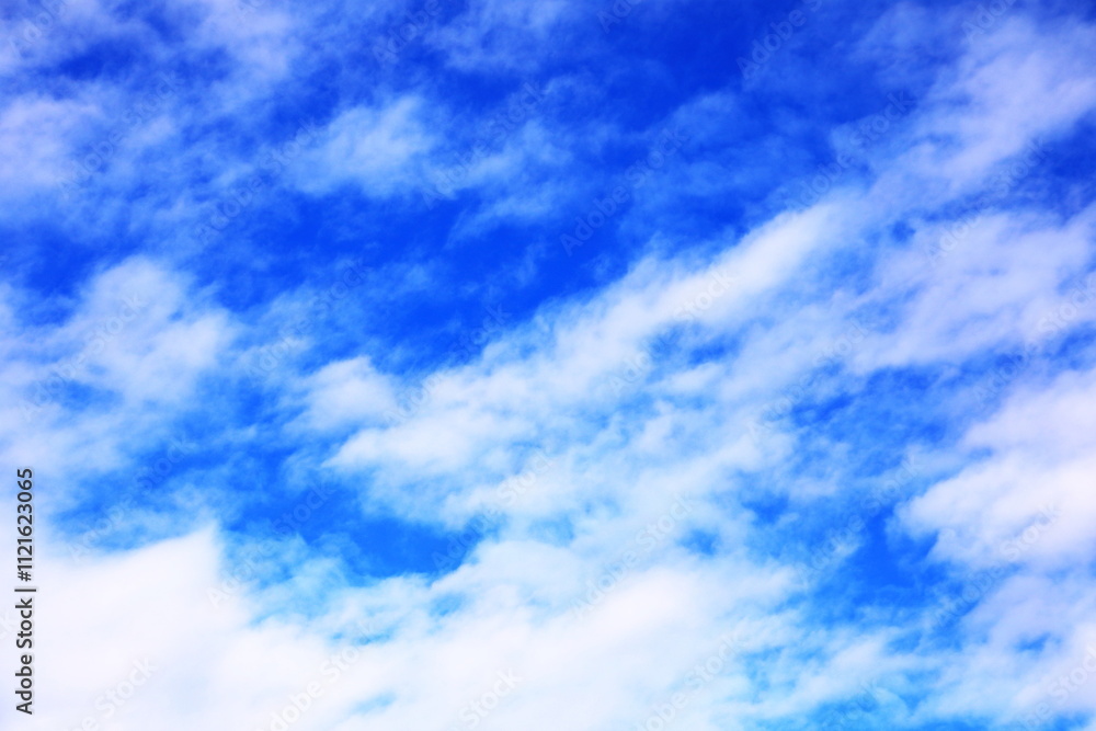 Naklejka premium 青空とふわふわとした白い雲
