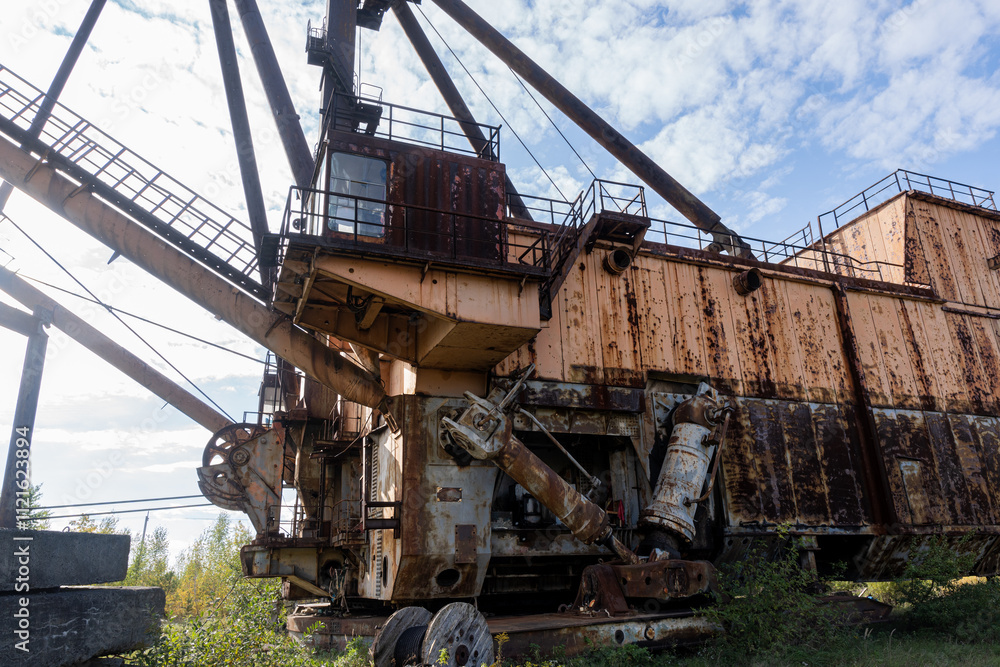 Abandoned Industrial Machinery in a Verdant Landscape Abandoned Industrial Machinery in a Verdant Landscape