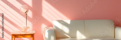 Cozy Living Room with Soft Lighting - A serene living room scene featuring a white couch and a stylish lamp against a pastel pink wall, showcasing natural light and modern design. photo